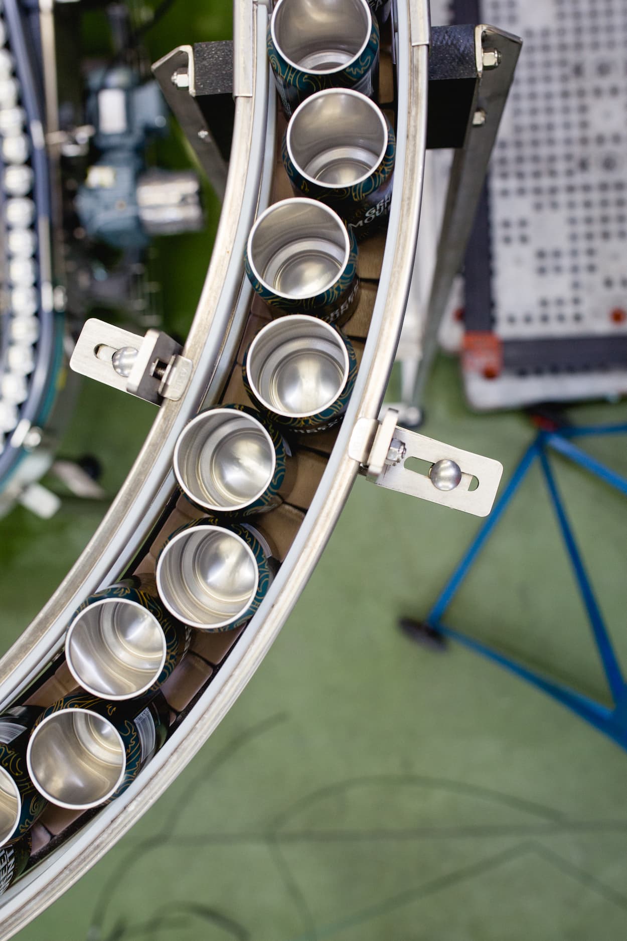 top down photo of cans moving along the canning line at thornbridge brewery