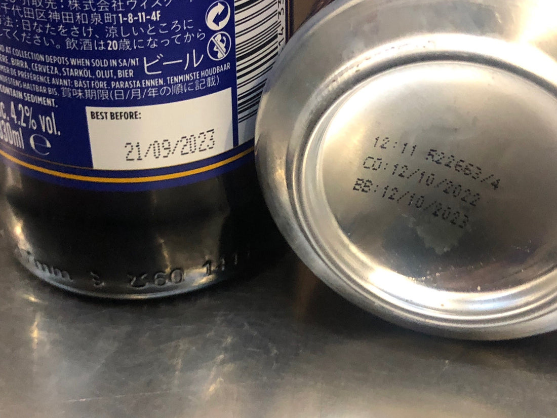 Back of the bottle and bottom of the can showing packaging dates and best before dates