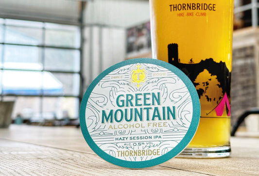 Green Mountain Alcohol Free keg clip with a pint of Green Mountain Alcohol Free