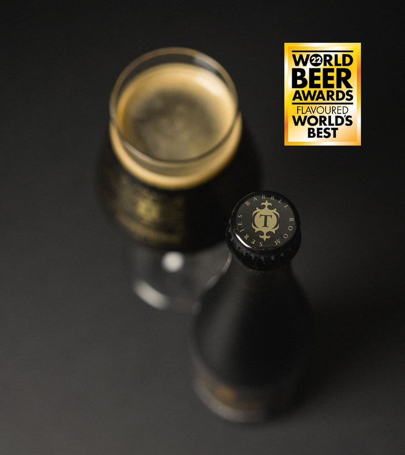A dark bottle of Necessary Evil with a black cap featuring the Thornbridge gold 'T' logo, shown alongside a glass of poured beer with a gold head and a 'World Beer Awards Flavoured Worlds Best' badge in the top right corner.