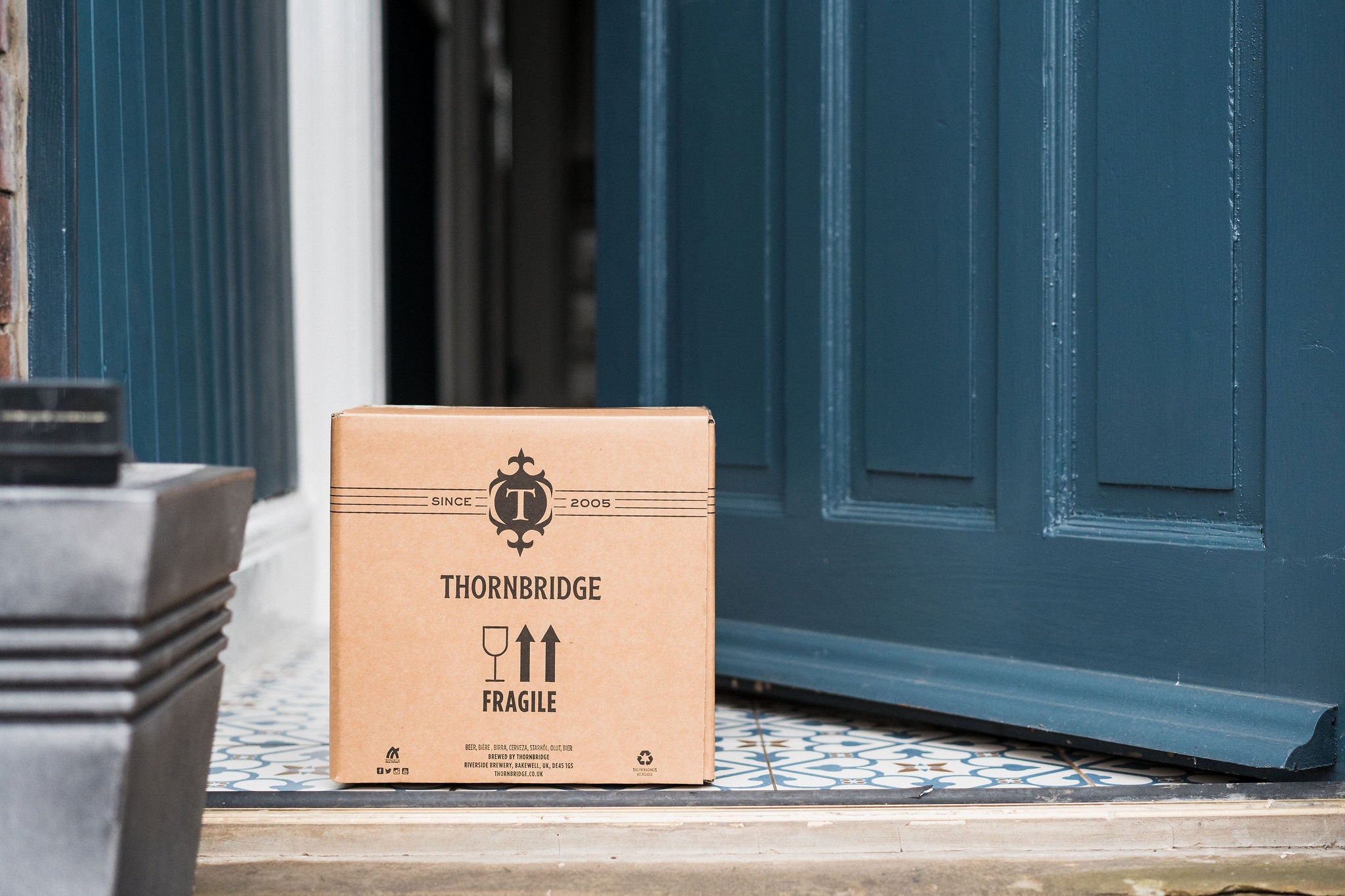 a subscription box delivery just dropped off outside a customer's door