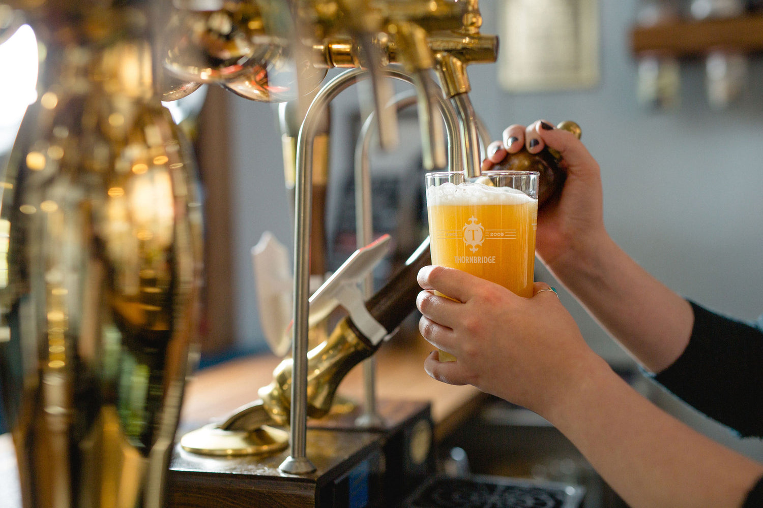 pint of beer being pulled at the coach and horses
