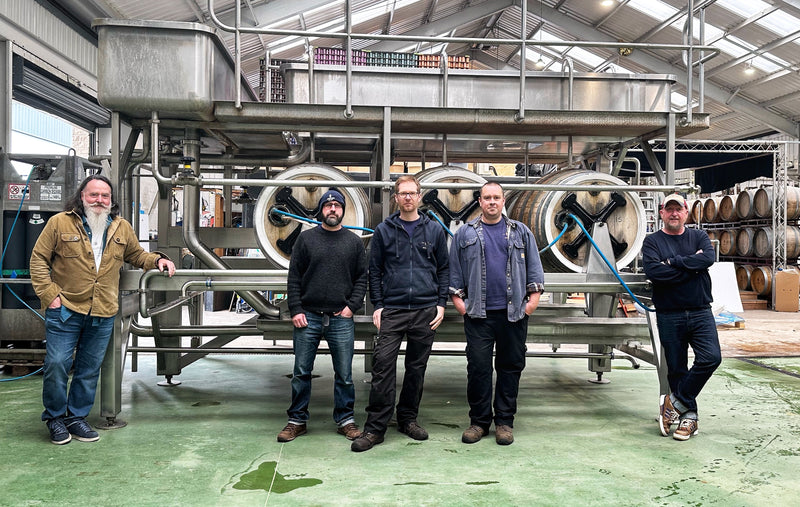 Brewers standing in front of the Union set.