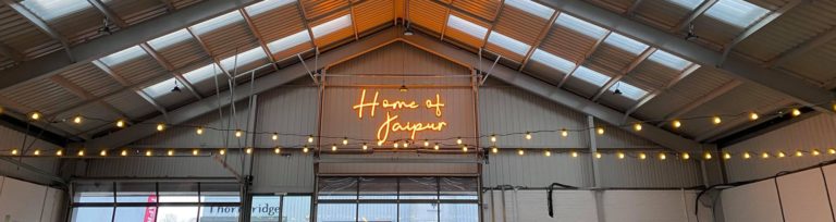 The Home of Jaipur neon sign lit up in the Taproom at Bakewell